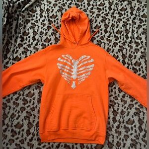 Orange hoodie heart shape design in front
